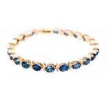 A sapphire and diamond set yellow gold line bracelet,