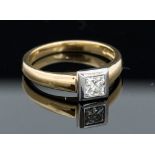 A Diamond solitaire 18ct yellow and white gold ring,