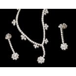 A diamond 18ct white gold drop line necklace and drop earring set,