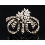 A diamond set platinum flower head cluster brooch,