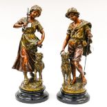 A pair of spelter figures on wooden bases, after Morcan,