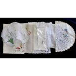 Seven tray cloths - various designs,