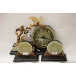 A French Art Deco onyx and marble clock garniture,