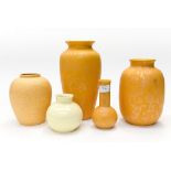 A collection of Poole Pottery, comprising a tall tapering vase, an ovoid vase,