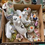 A collection of Staffordshire flatbacks, dog, pastille burners,