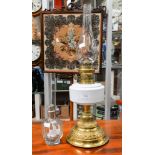 A Martins Patent brass twin burner oil lamp, having embossed brass base,