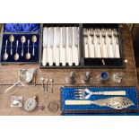 A boxed set of fish servers, a set of six silver coffee spoons,