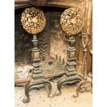 A pair of 17th Century style iron and brass andirons,