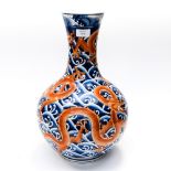 A Chinese baluster vase 19th Century in blue with iron red Dragons,