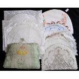 A collection of vintage tea cosy's to include a linen embroidered with pink flowers and two line