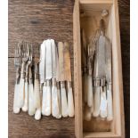 A set of thirty-four EPNS and mother of pearl knives and forks in a wooden box