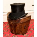 A black silk top hat in leather case,