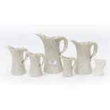 A set of six Royal Worcester leaf moulded jugs, ivory finish,