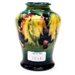 A Moorcroft shouldered vase, grapes and vine pattern on cobalt ground fading upwards to green,