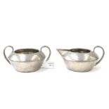 A pewter Liberty and Co sugar bowl and creamer (2)