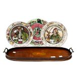 An Edwardian mahogany and satinwood cross banded oval tea tray, having central conch shell paterae,