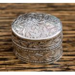 A Continental silver pill box of oval form,