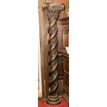 A pair of carved wood Renaissance style barley twist and floral garland columns with composite