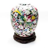 A large Chinese famille rose ginger jar on hardwood stand,
