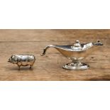 An Edwardian silver pin cushion in the form of a pig,