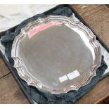 A twentieth Century silver salver on three scroll feet, pie crust border, Parkin Silversmiths Ltd,