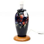 A Moorcroft baluster shape lamp base (with oak) support, blue ground,