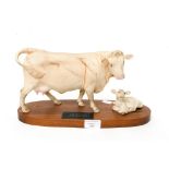 A Beswick figure of a Charolais Cow and Calf on wooden base