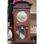 An Art Nouveau mahogany cased eight day clock with Westminster chime (1)