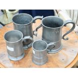 A quart pewter mug with a hooded ball handle;