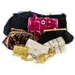 A collection of handbags to include a deep pink early 1950s crushed velvet with diamante paste clip