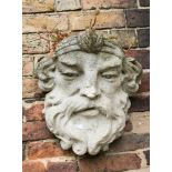 A stone Bacchanalian head planter,