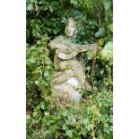 A stone figure of a putto playing a lute,