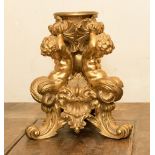 A 19th Century ormolu figural stand in the form of three Mermen putti supporting a mount,