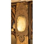 An 18th Century or later carved wood looking glass,