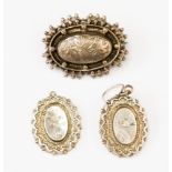 A Victorian pair of silver earrings together with a Victorian silver brooch with hair compartment