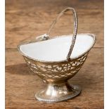 A George III pierced silver bon bon dish with original milk glass liner,