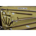 A large display board of Vintage Rural Bygone Harvesting Tools to include Thaching rakes,