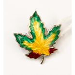 A silver and enamelled leaf brooch, circa 1940s, in the form of a Maple Leaf in green,