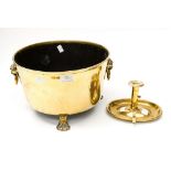 A brass and coal bucket with Lion head handles and Lion paw feet;