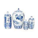 A collection of Chinese blue and white vessels with lids,