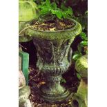 A cast iron campana urn planter, relief molded with figures,