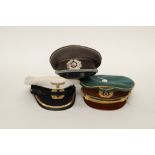 Three caps: Original East German Army Officers Schirmmutze service dress cap,