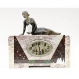 An Art Deco marble cased eight day mantle clock, the case with geometrically inset marble segments,