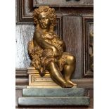 A gilt bronze figure of St John the Baptist as a child, on stepped green marble base,