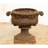 A small cast iron urn vase or planter,