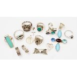 A collection of sterling silver dress rings, set with various stones, including turquoise,