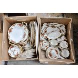 Two boxes of Royal Albert 'Old Country Roses' dinner and tea wares, including server and covers,