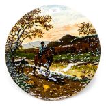 A Studio pottery charger, showing child on back of Shire Horse, dated to reverse Oct 1888,