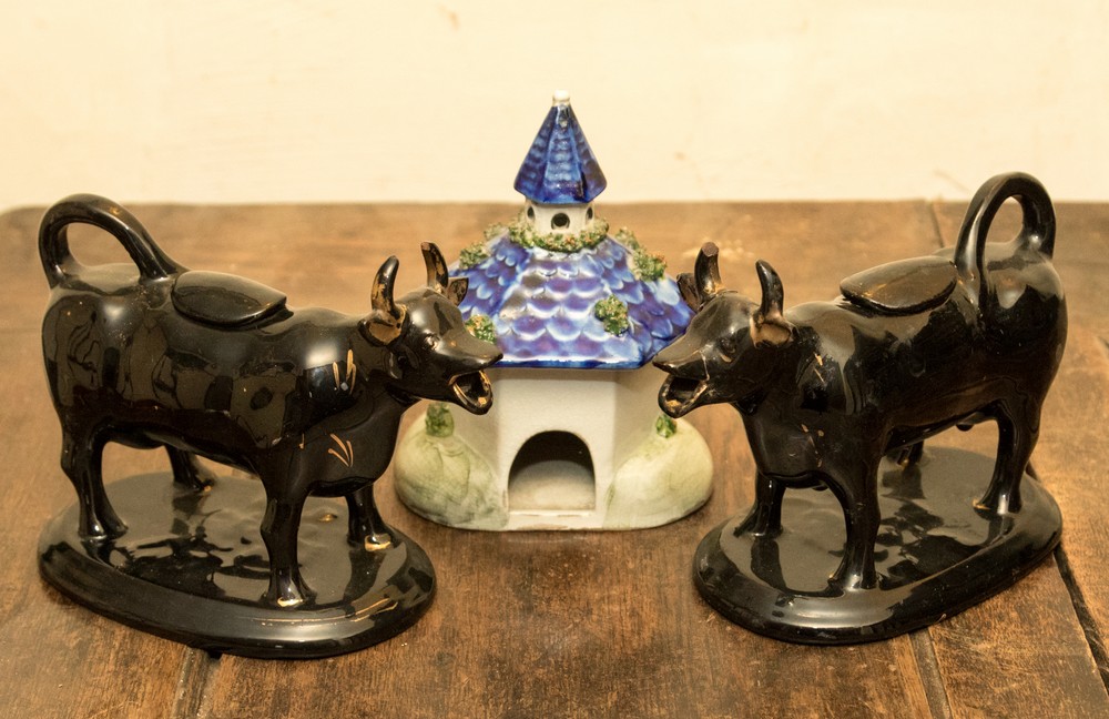 A pair of Staffordshire black glazed cow creamers and a pastille burner (3) - Image 2 of 2