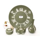 A collection of Wedgwood green Jasperware, comprising: a plate; two lidded pots and a vase,